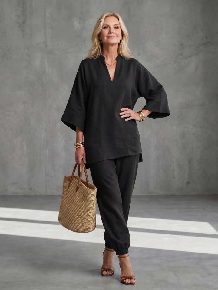Women's elegant V-neck tunic and gathered trouser two-piece set for a relaxed look.