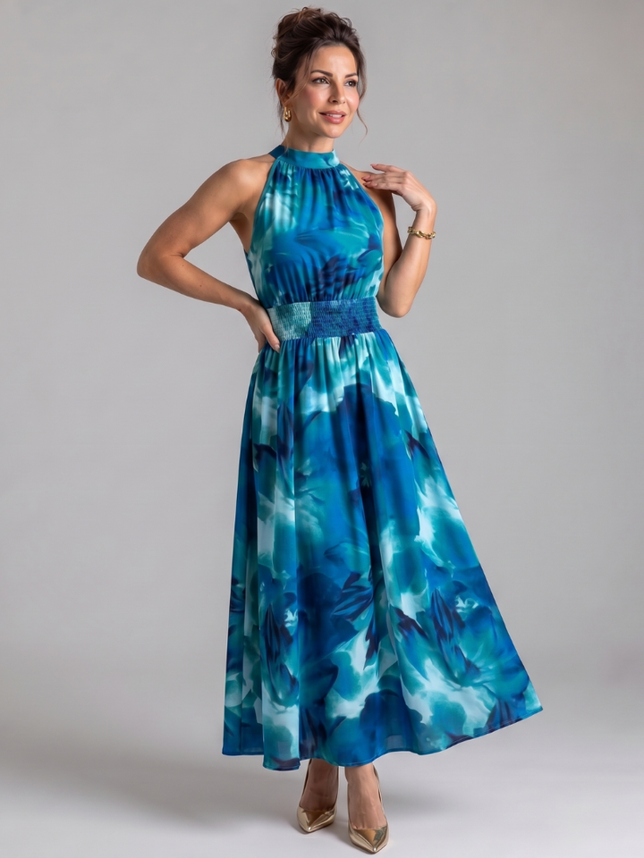 Summer-ready women's flowy midi dress with a bold abstract print, comfortable gathered waist. Elegant vacation wear.