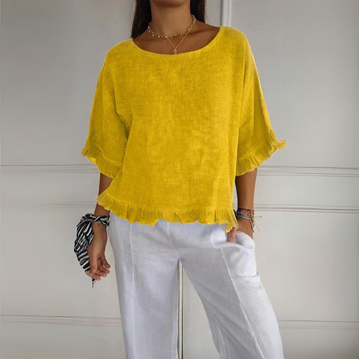 Feminine modern women's ruffle blouse. Stylish, comfortable, and versatile long sleeve top for elegant fashion.