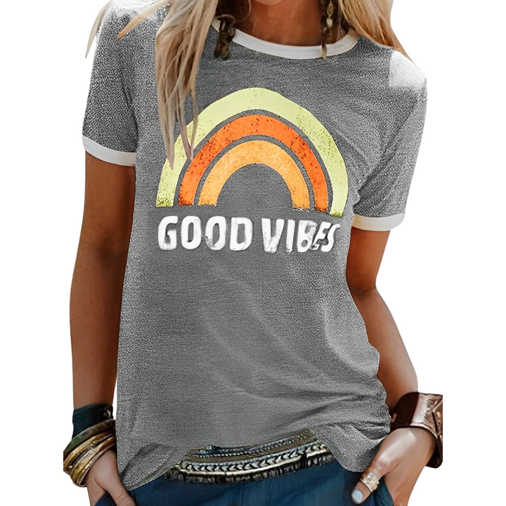 Women's positive energy 'Good Vibes' graphic tee featuring a colorful rainbow print, ideal for a cheerful casual top.