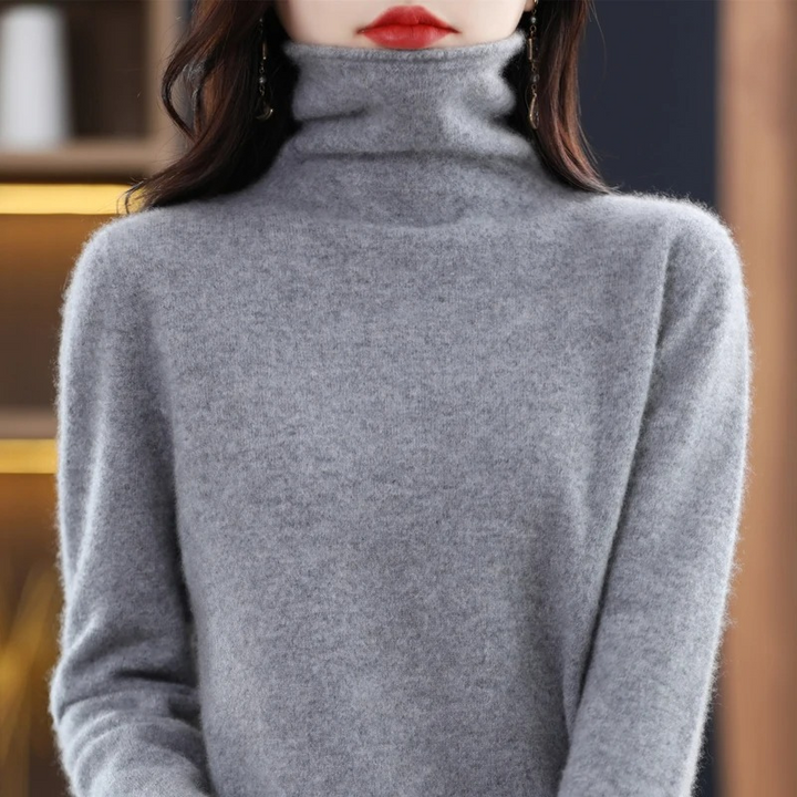 Cozy women's long sleeve sweater. Soft roll neck top, a winter essential.