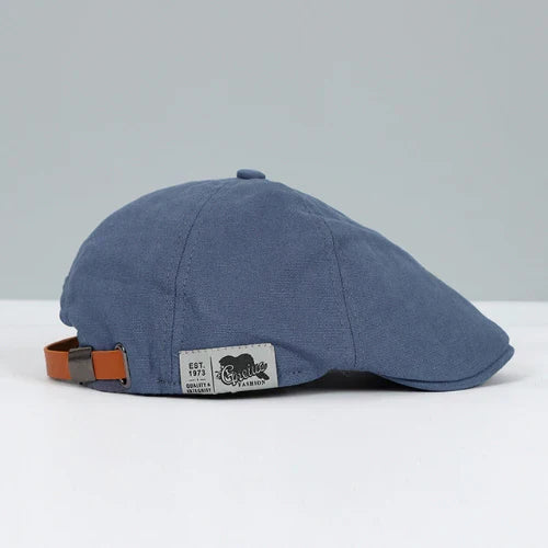 Classic men's adjustable ivy cap with a buckle, ideal headwear for versatile casual fashion.
