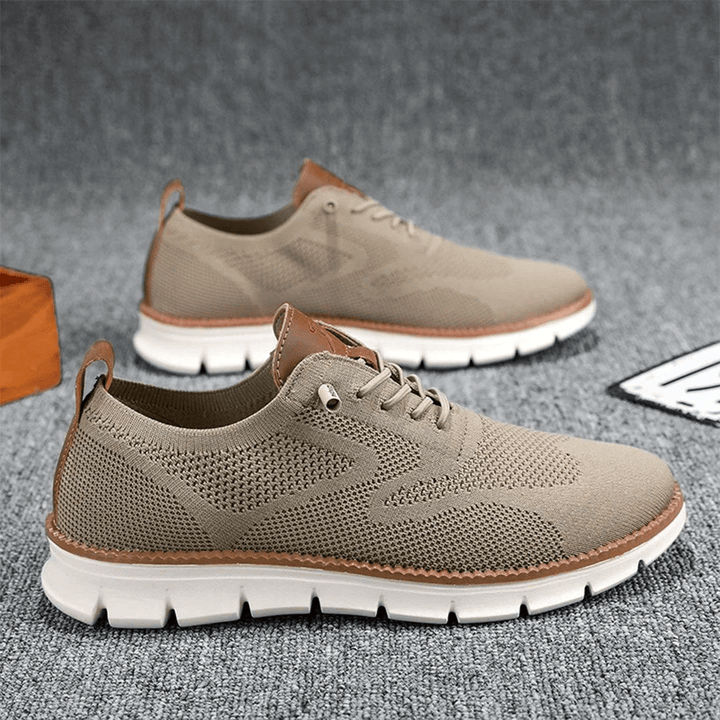 Lightweight men's everyday sneakers, perforated for ventilation, offering ultimate comfort.