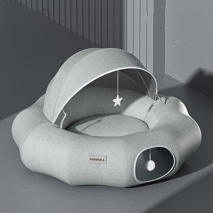 Versatile pet bed for cats & small dogs, offering a cozy den with a removable roof & attached toy. Perfect for rest.