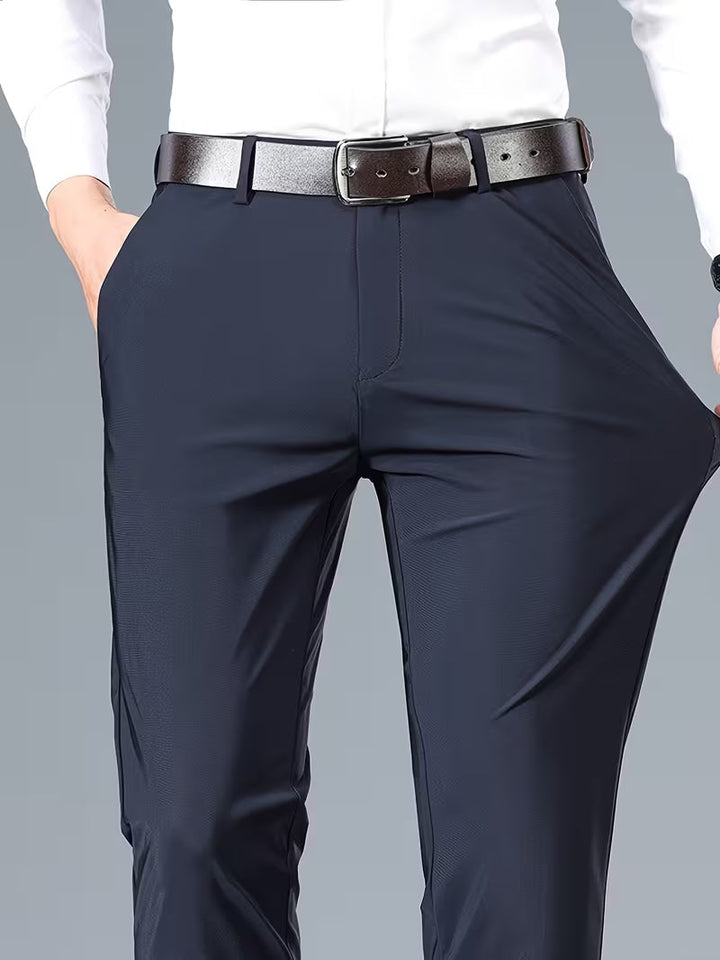 Versatile men's navy blue stretch pants, perfect for casual or formal wear. Comfortable tailored fit trousers.