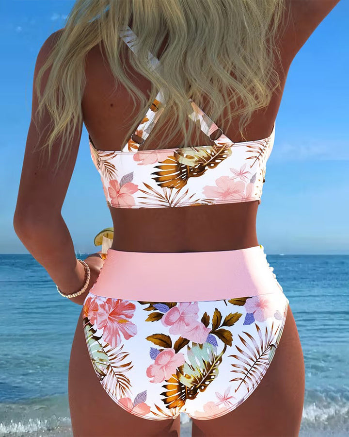 Elegant women's swimwear: high-waisted floral print bikini featuring fashionable cut-outs.
