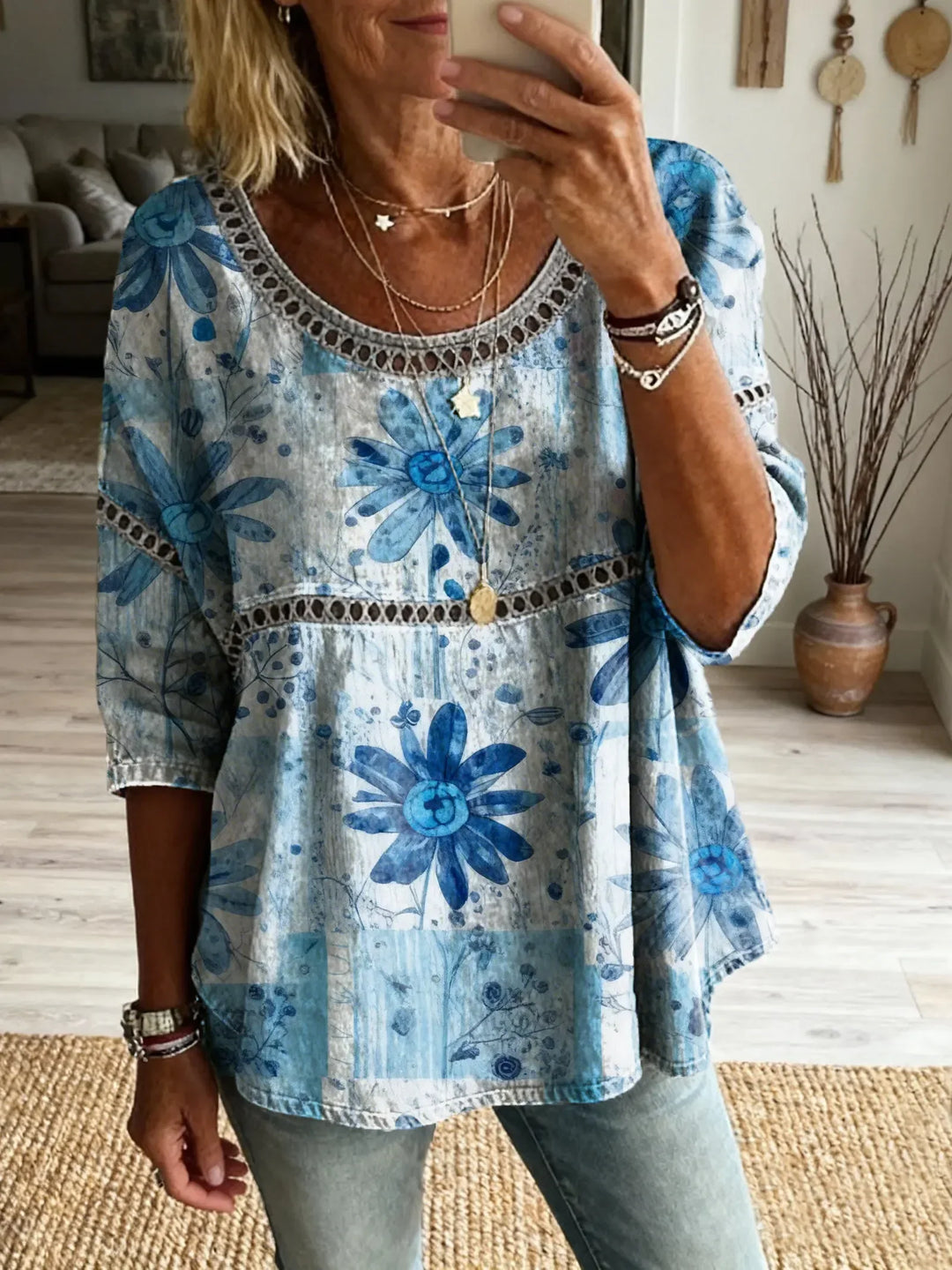 Women's relaxed fit blouse with colorful floral embroidery, perfect for everyday casual wear and comfort.