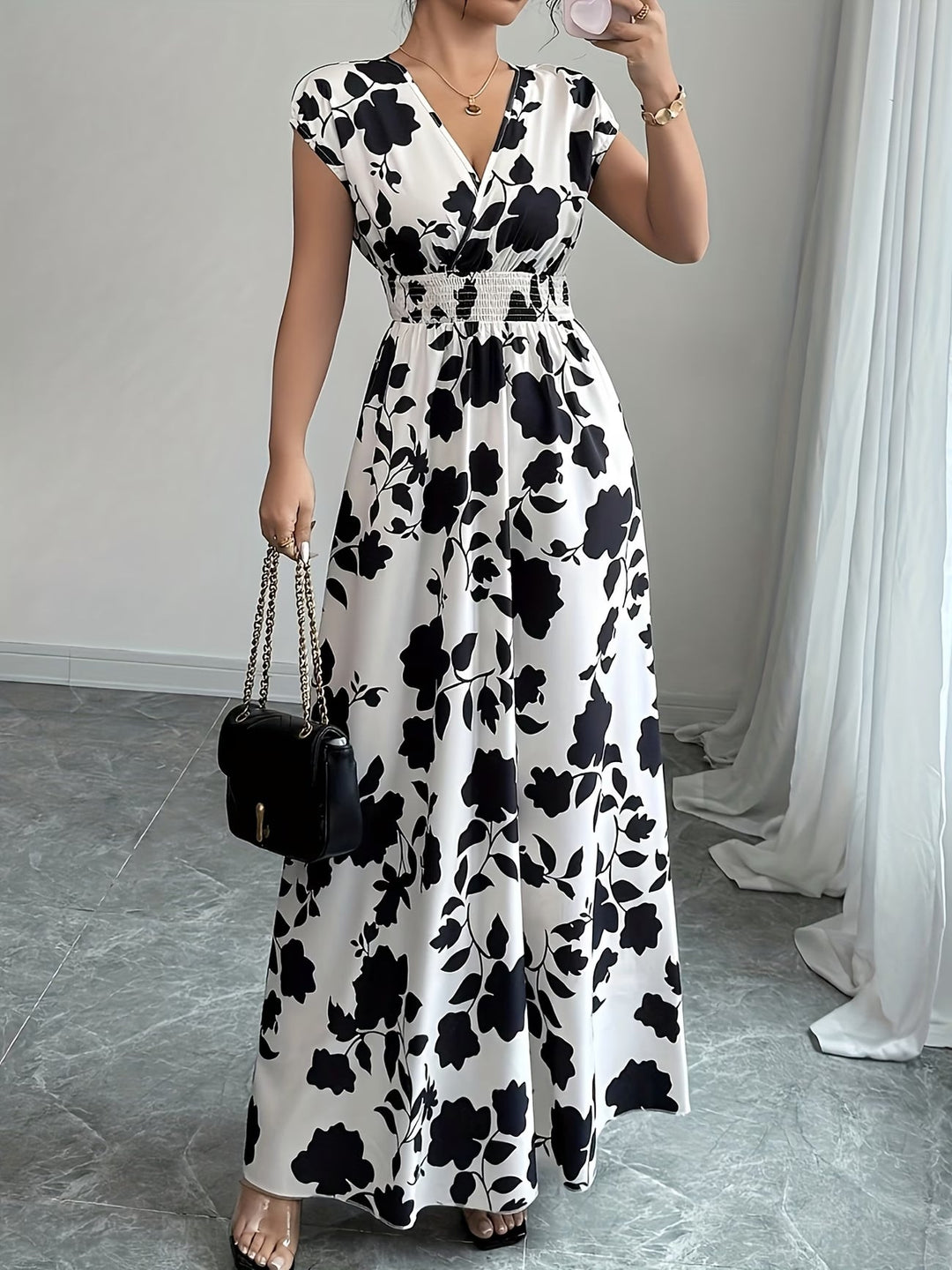 Comfortable elegant V-neck sleeveless dress. Women's versatile black midi for summer.