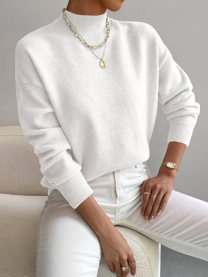 Knitted high neck jumper for ladies, offering cozy autumn winter style.