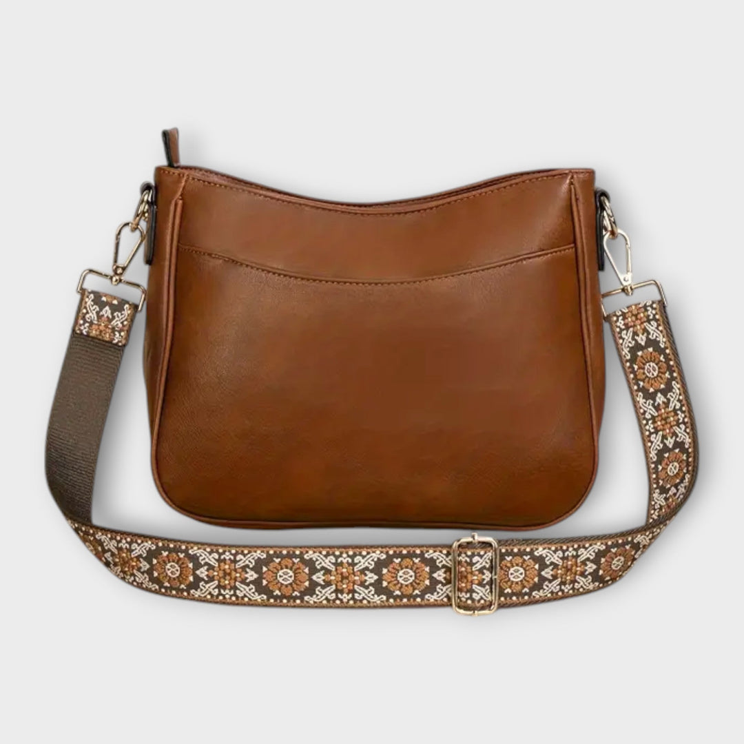 Stylish brown vegan tote bag for women, an eco-friendly shoulder handbag accessory for daily fashion.