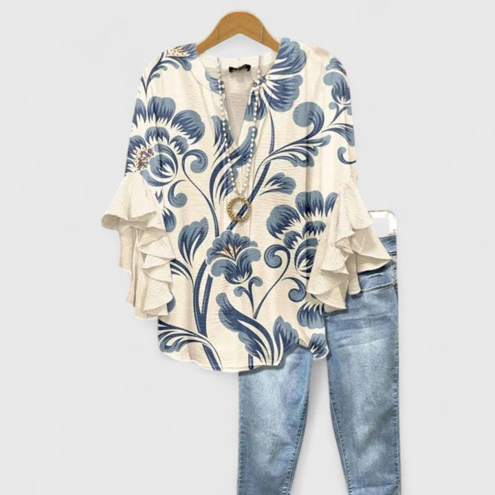 Women's comfortable floral ruffled blouse for elegant spring and summer fashion.