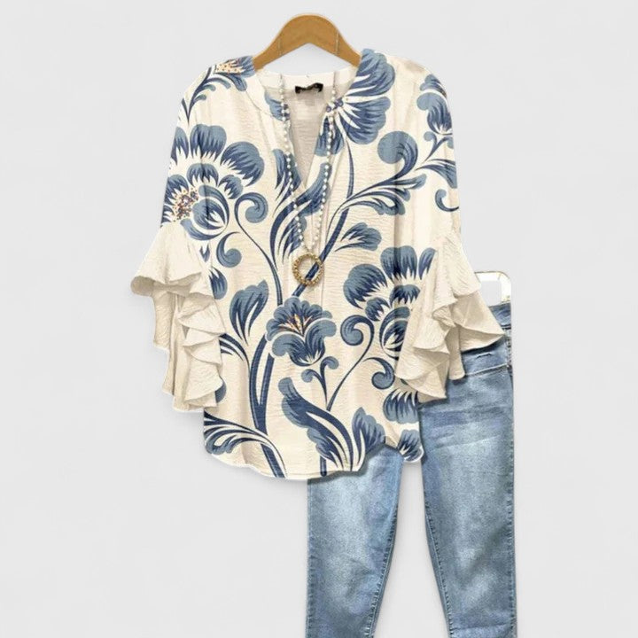 Elegant women's floral print blouse with stylish ruffle sleeves, perfect for chic casual wear.