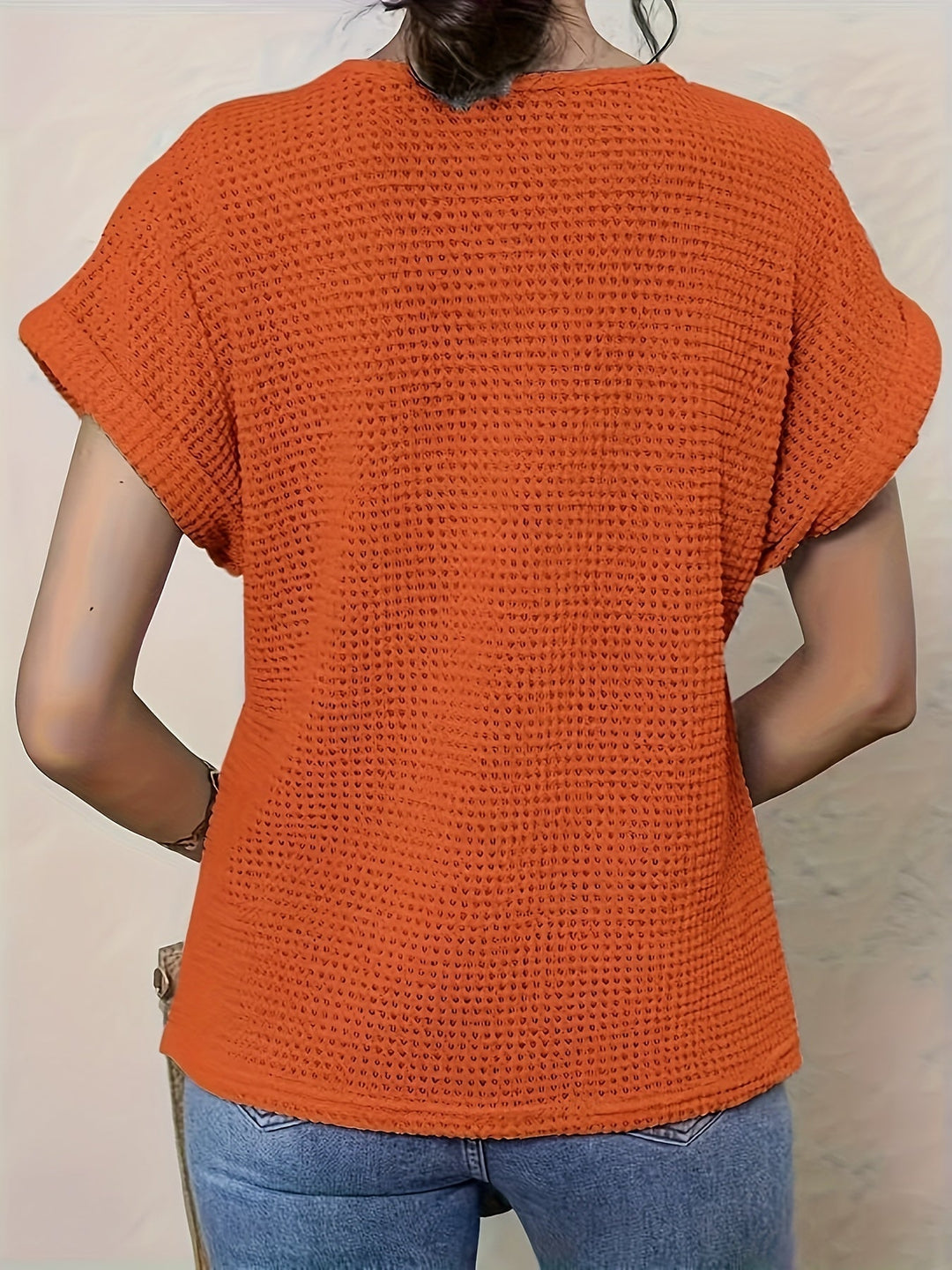 Stylish ladies' fashion top: round neck, short sleeve blouse with elegant crochet detailing for a modern look.