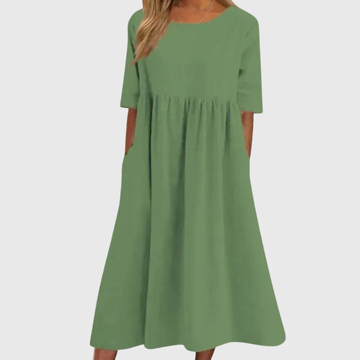 Flattering women's short sleeve midi dress, designed with an elegant cut for a chic, comfortable fit.