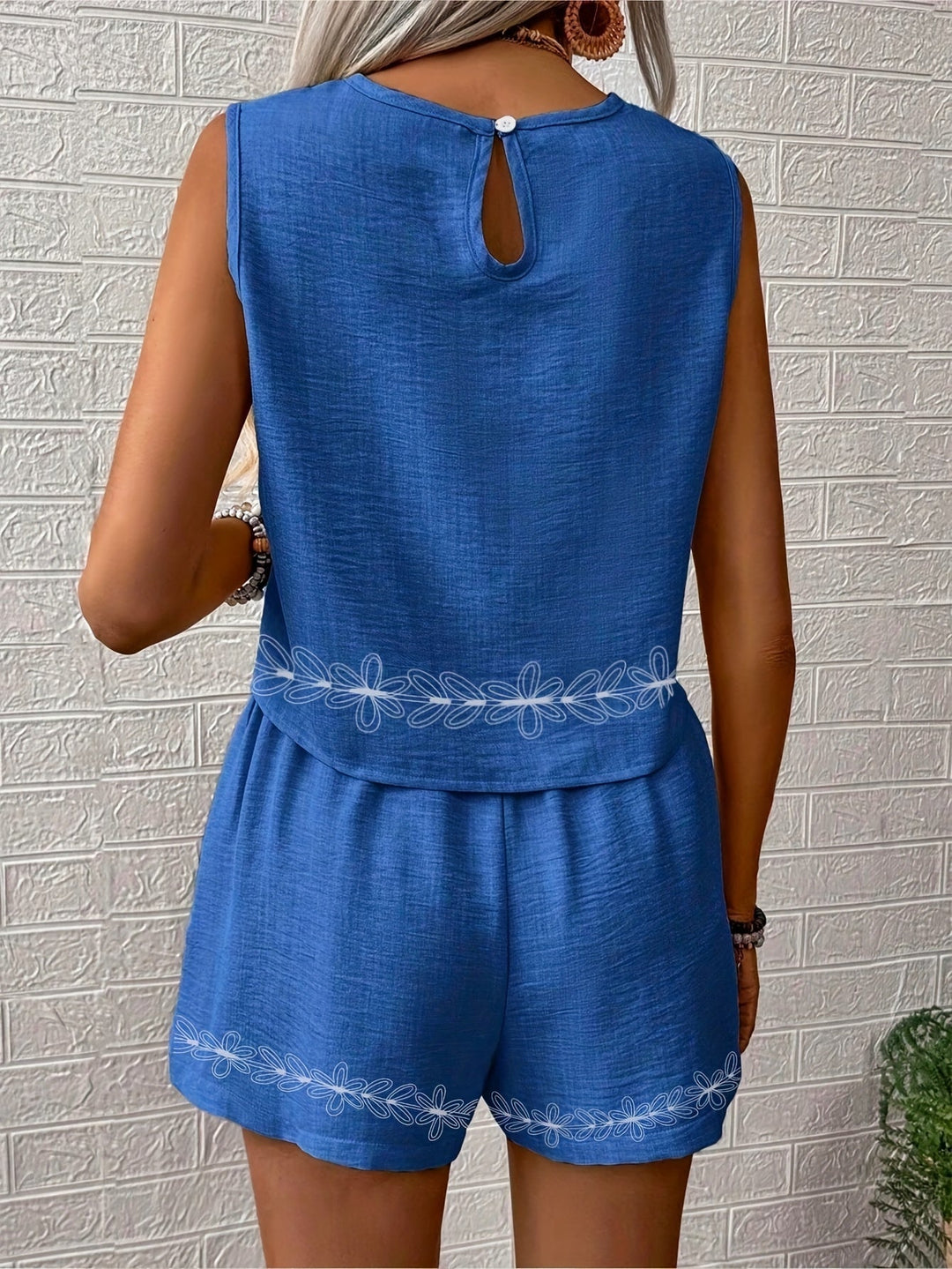 Casual women's boho summer outfit: sleeveless geometric pattern top & relaxed fit shorts.
