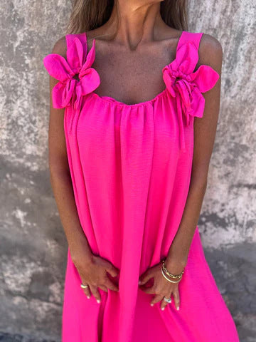 Feminine women's maxi dress featuring stylish bow straps & a flattering U-neckline for elegant summer wear.