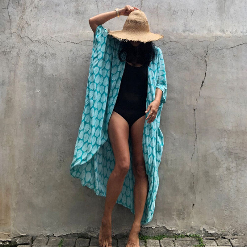 Elegant women's beach cover up, sun protection beachwear, perfect for any vacation outfit.