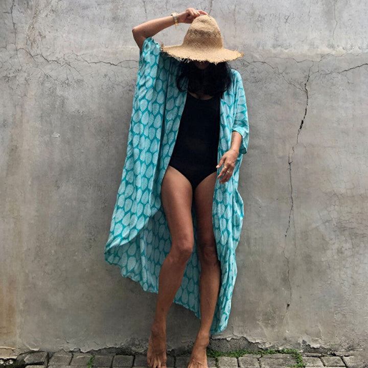 Elegant women's beach cover up, sun protection beachwear, perfect for any vacation outfit.