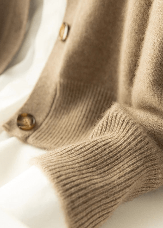 Sophisticated women's knit cardigan with elegant buttons and long sleeves.