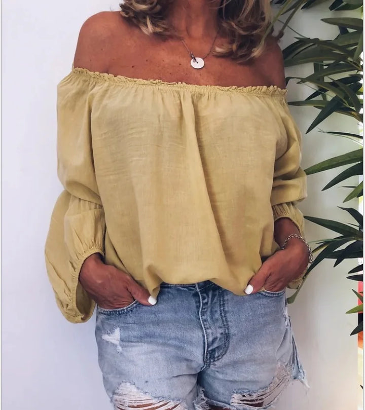 Comfortable women's off-shoulder blouse. Elegant balloon sleeves create a chic, fashionable silhouette.