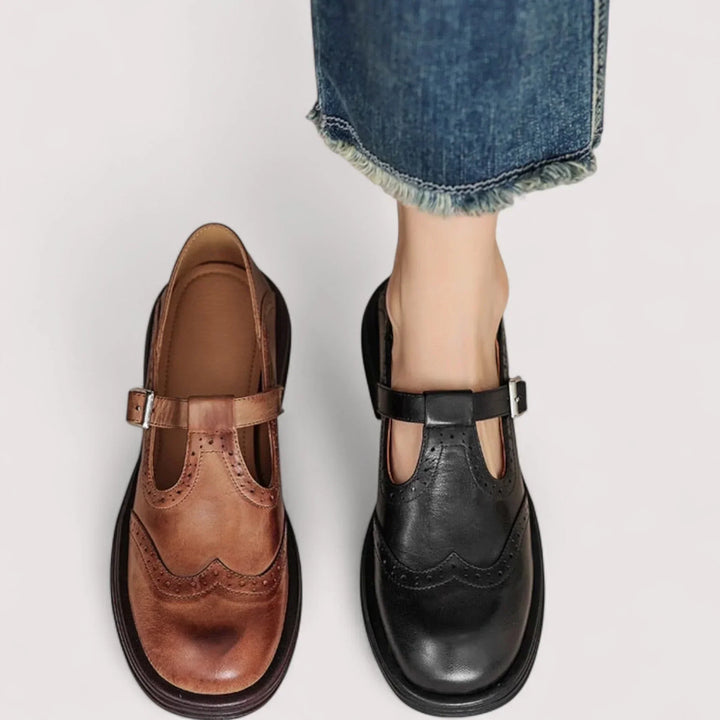 Vintage-inspired black Mary Jane women's shoes with classic brogue details and a secure, comfortable strap.