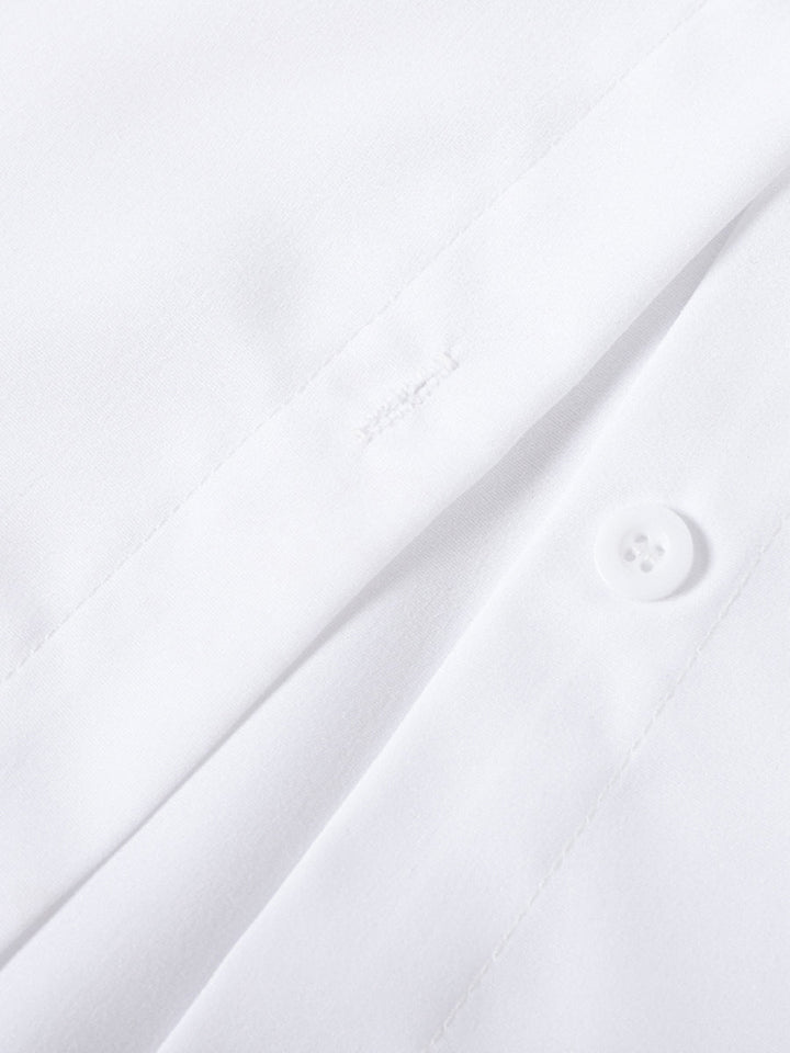 Stylish women's tiered ruffle blouse. Elegant button-up top with flare sleeves for a feminine spring look.