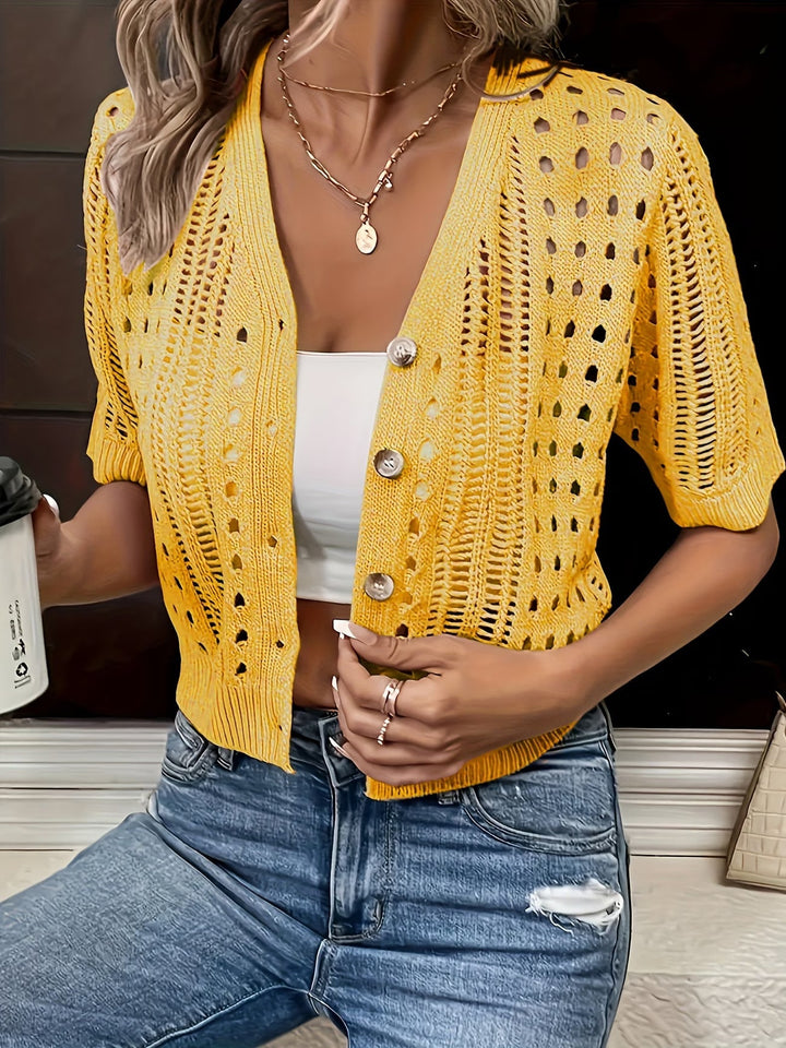 Comfortable women's short sleeve summer cardigan, an elegant, open-front top for chic layering.