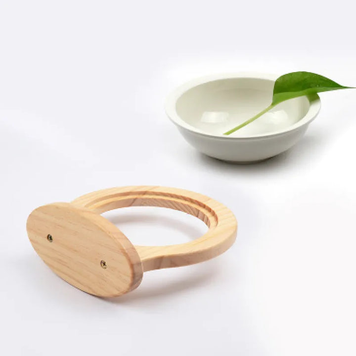 Wooden wall-mounted cat feeder with a charming cloud design. Elevated pet bowl is perfect for modern cat care.