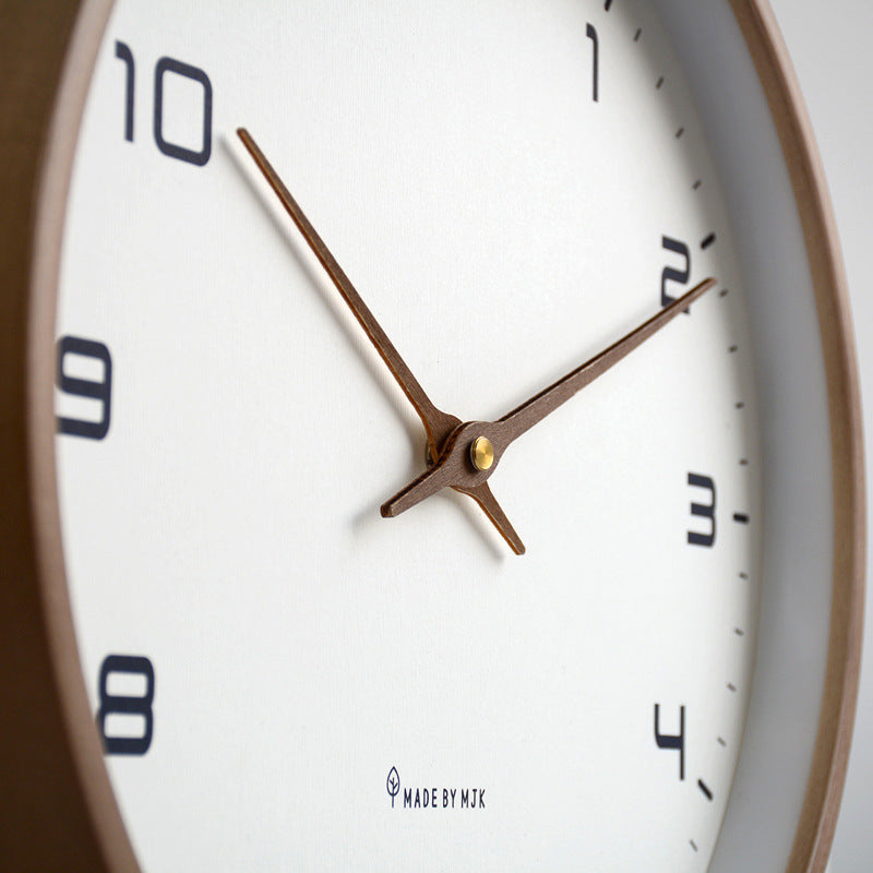 Timeless minimalist silent wall clock with a wooden frame. An ideal housewarming gift for modern homes.