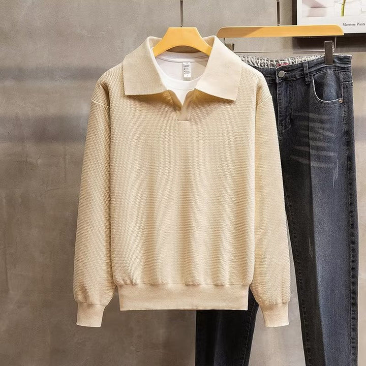 Comfortable men's polo sweater with relaxed fit and elegant ribbed knit, perfect for casual winter wear.