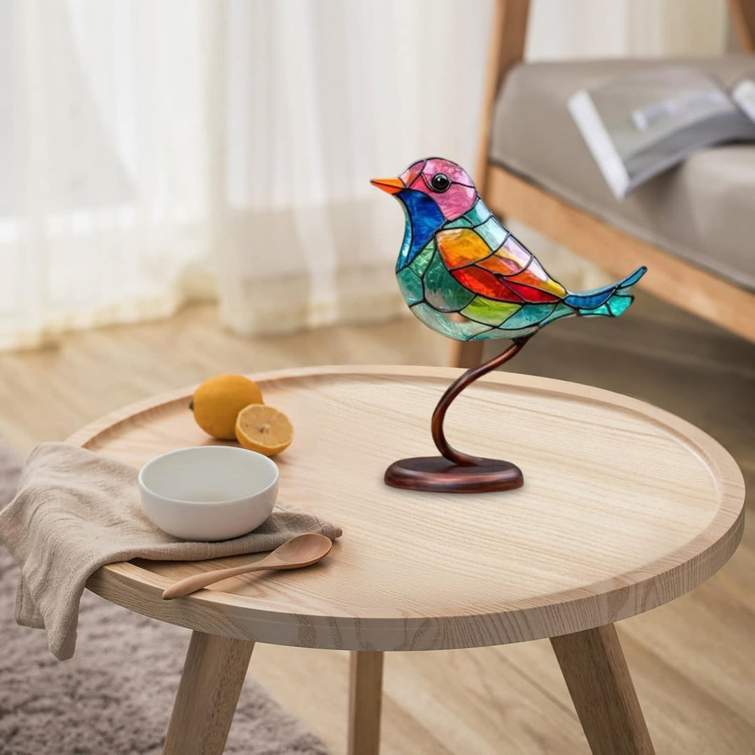 Elegant tabletop bird sculpture, modern art design with vibrant coloured glass, a serene accent.