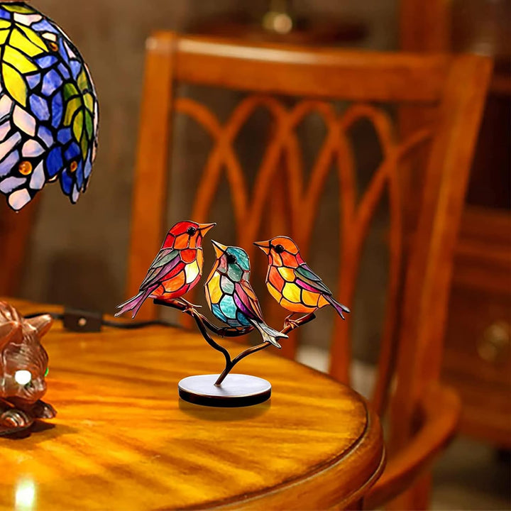Vibrant modern bird sculpture, elegant coloured glass tabletop decor, unique artistic home accent.