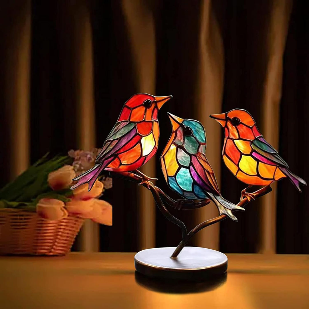 Graceful modern bird art sculpture, elegant coloured glass tabletop decor, unique artistic design.