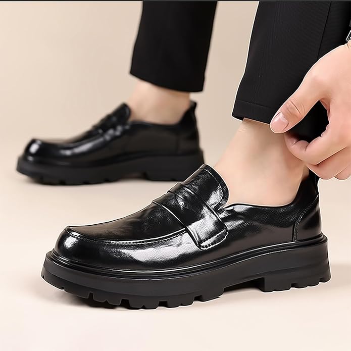 Men's black moc toe penny strap slip-on loafers. Classic, comfortable dress shoes for formal or casual wear.