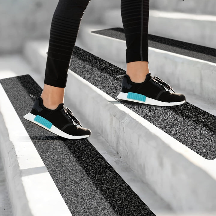 Durable rubber anti-slip strips for outdoor & indoor stairs, ensuring safe tread & preventing slips.