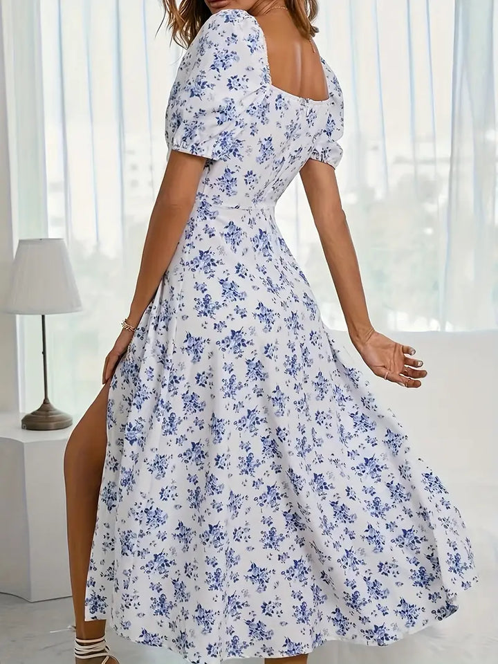 Women's chic floral A-line midi dress with elegant puff sleeves, perfect for summer fashion.