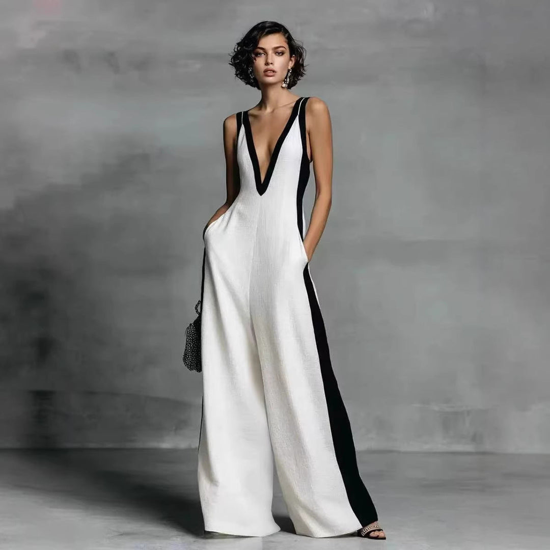 Elegant women's colour-block jumpsuit with V-neck, sleeveless design, and wide legs for smart casual or evening wear.