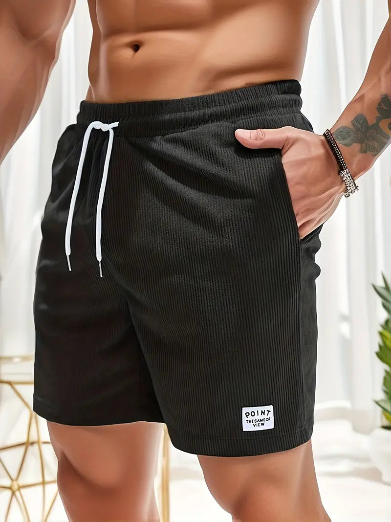 Stylish green men's ribbed quick-dry shorts with elastic waist for casual summer outfits.