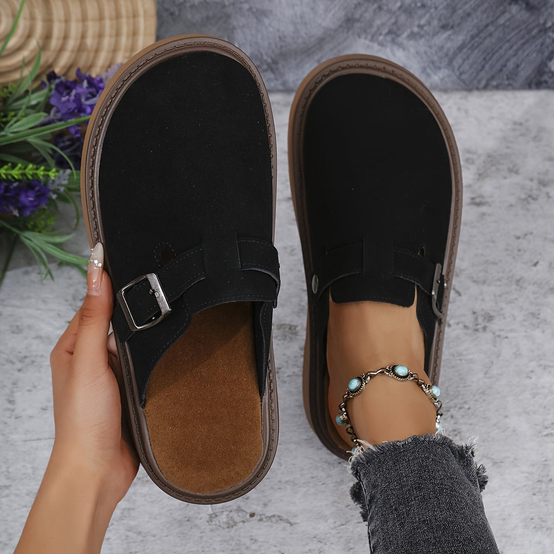 Stylish women's platform clogs with adjustable strap, ideal for casual outfits.