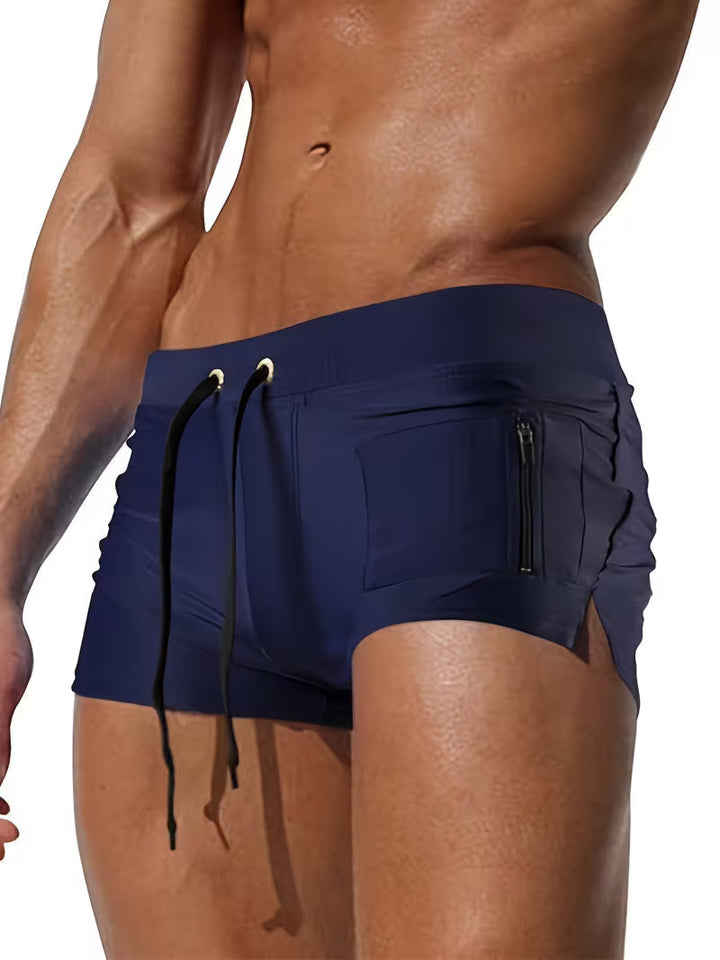 Quick-dry men's swim shorts, modern boxer trunks design with a convenient zipper pocket, ideal for summer beachwear.
