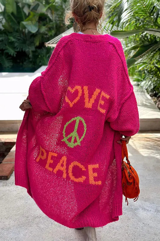 Comfortable women's oversized cardigan in a vibrant 'Love & Peace' design, ideal for casual, trendy wear.