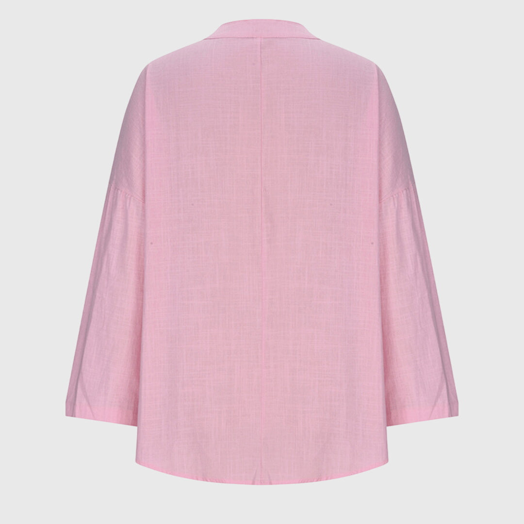 Flowing women's summer blouse, a versatile and lightweight top for beach, resort, or casual wear.
