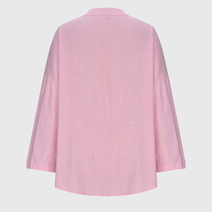 Flowing women's summer blouse, a versatile and lightweight top for beach, resort, or casual wear.