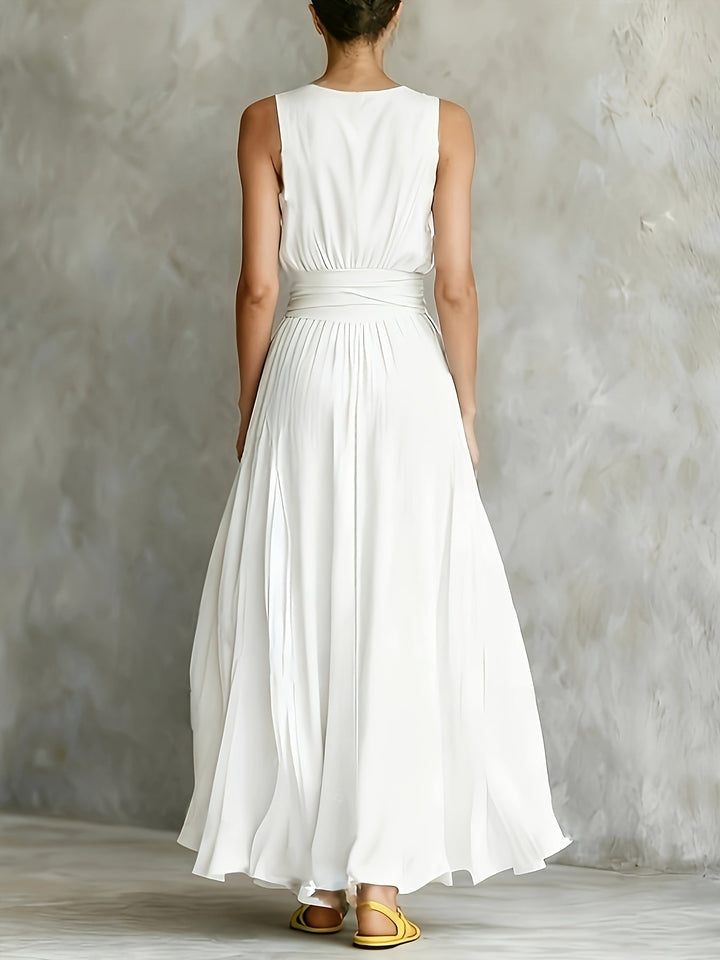White sleeveless A-line maxi dress for women, featuring a flattering belted waist and flowy elegant design for summer wear.