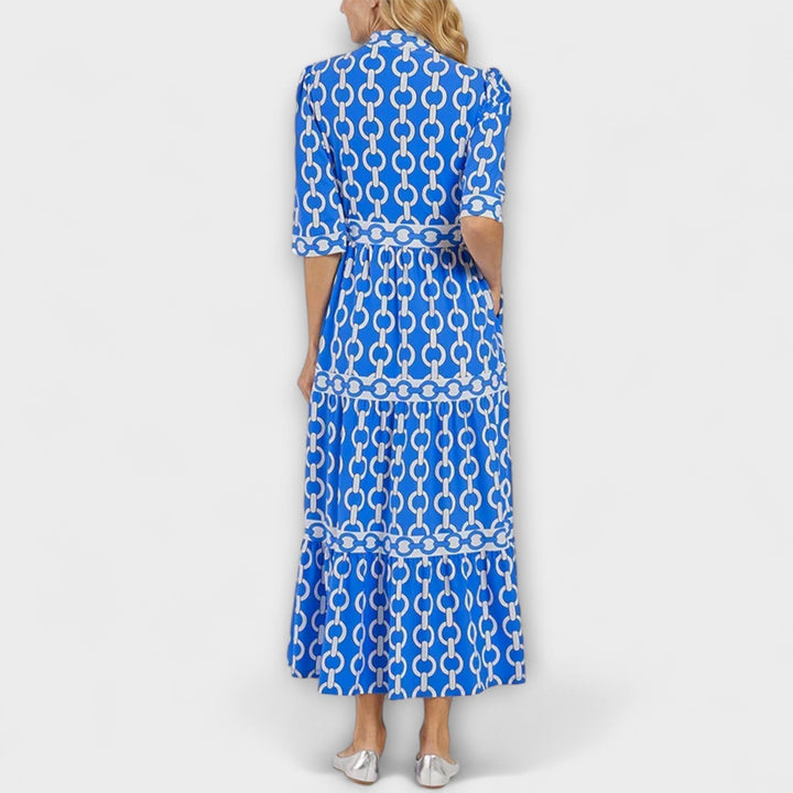 Fall fashion women's midi dress: elegant chain print, collared neck, and three-quarter sleeves.