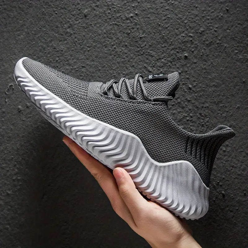 Stylish men's lace-up sneakers, lightweight & versatile for athletic activities or comfortable casual daily wear.