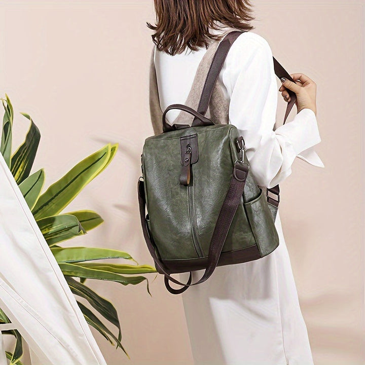 Brown women's everyday anti-theft backpack. Ideal commuter bag for urban fashion and secure daily carry.