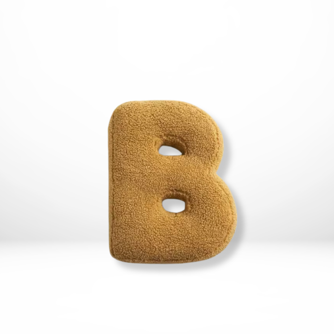 Stylish velvet 'F' letter cushion, adding personalized charm to any living space or bedroom decor.
