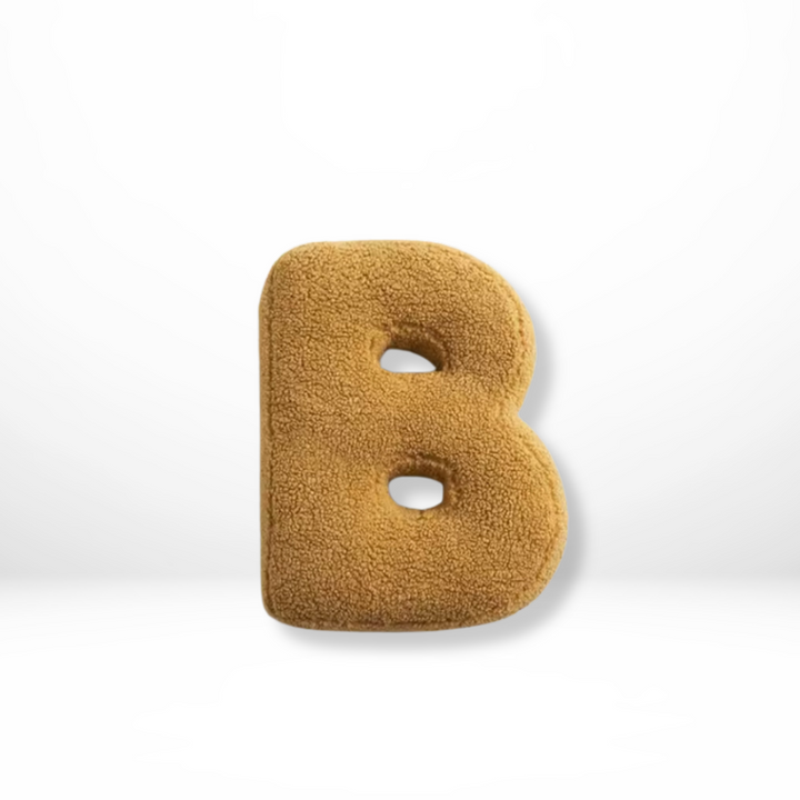 Stylish velvet 'F' letter cushion, adding personalized charm to any living space or bedroom decor.