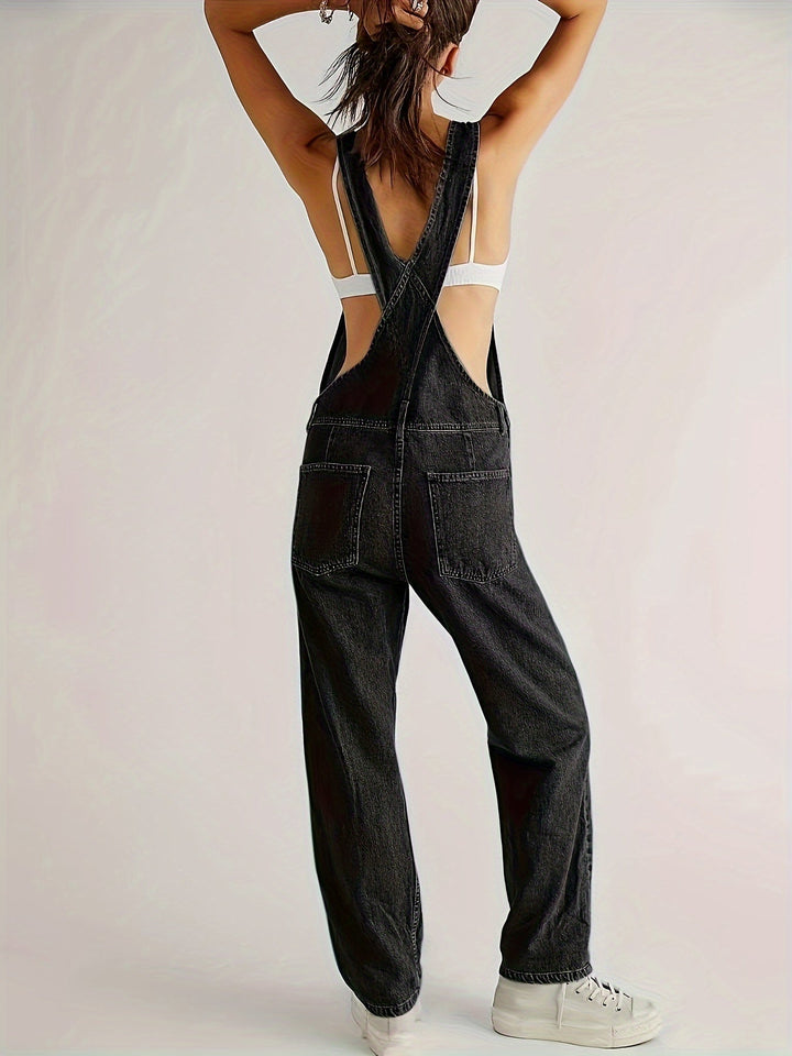 Woman walking in loose fit denim dungarees, casual and comfortable overalls for everyday wear.